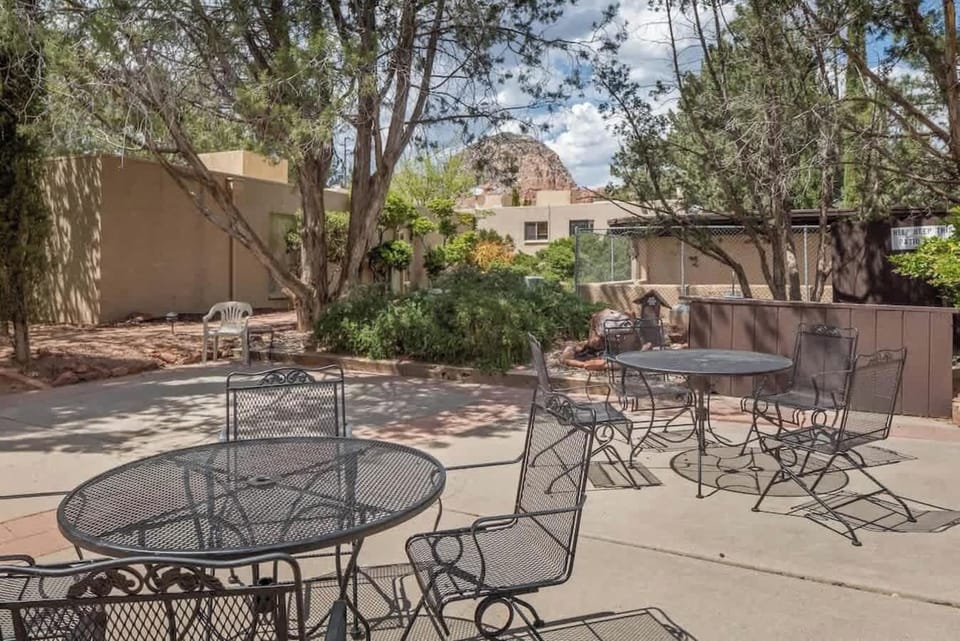 In addition to your own patio, along a gravel path is this large shared patio to enjoy. Wine, dine, read or relax next to the arroyo - Thunder Mountain in the background.  The laundry room is here for your use.
