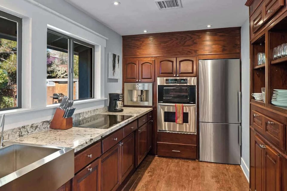 Fully loaded kitchen with plenty of room for home cooking. Enjoy natural lighting and views.