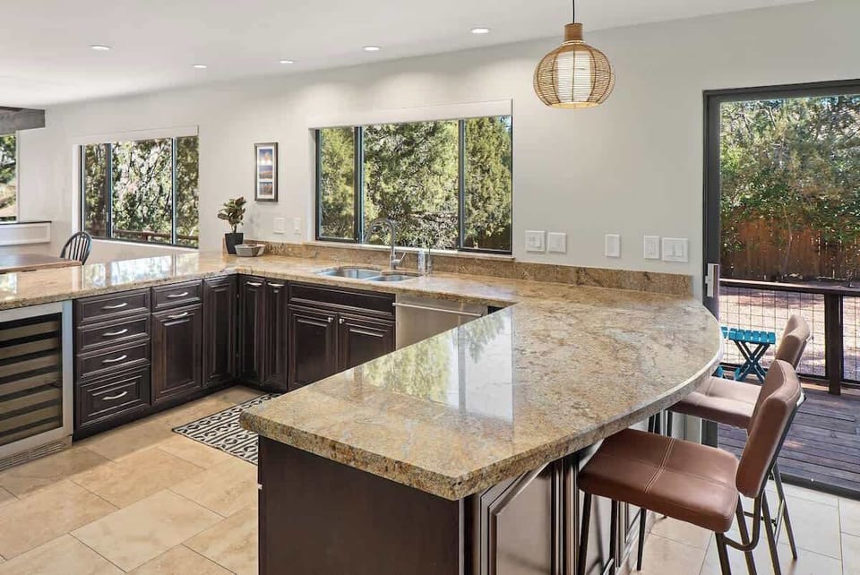 Chef's kitchen fully equipped with stunning views.