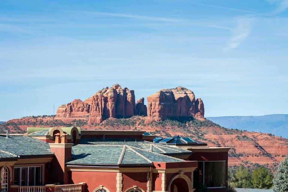 Perfect side porch view of the mansion and red rocks.