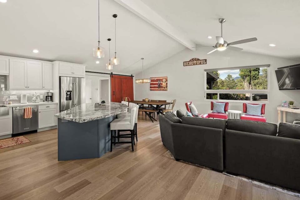 Full layout of i living area alongside dining and kitchen 