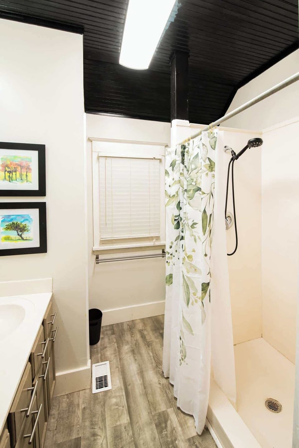 Freshen up in this well-appointed bathroom with a walk-in shower and modern fixtures.