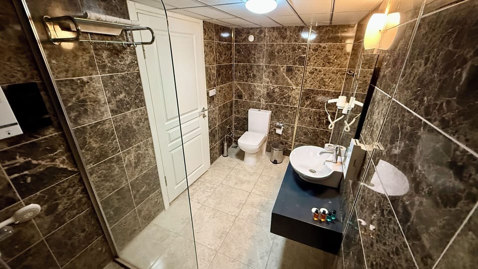 Standard Double Room | Bathroom | Shower, hair dryer, towels, soap