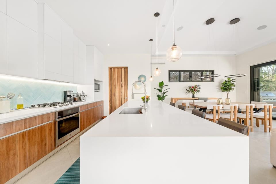 Chef ready kitchen with large island and bar seating for four.