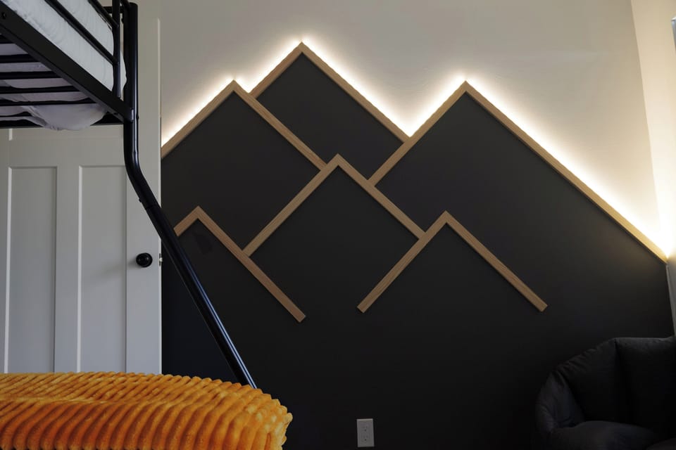 Feature wall with color adjustable mountain lights.