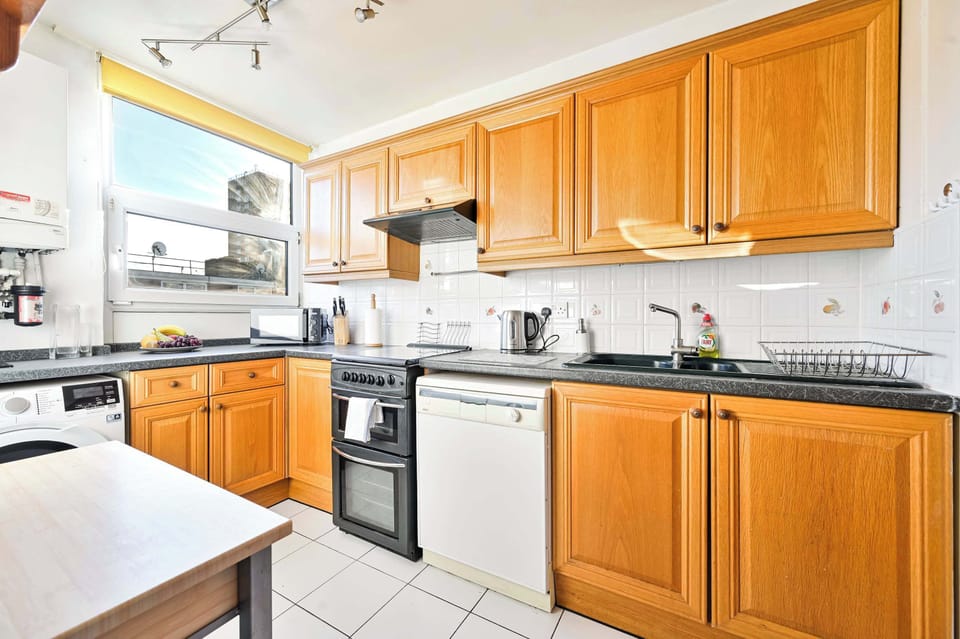 Fully equipped kitchen with microwave, kettle, dishwasher and a washer/dryer.
