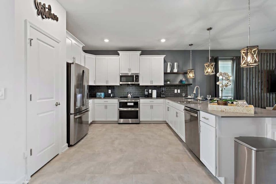 Step into our fully equipped kitchen and get ready to whip up your favorite meals. With stainless steel appliances, granite countertops, and plenty of counter space, our kitchen has everything you need to cook up a storm. 