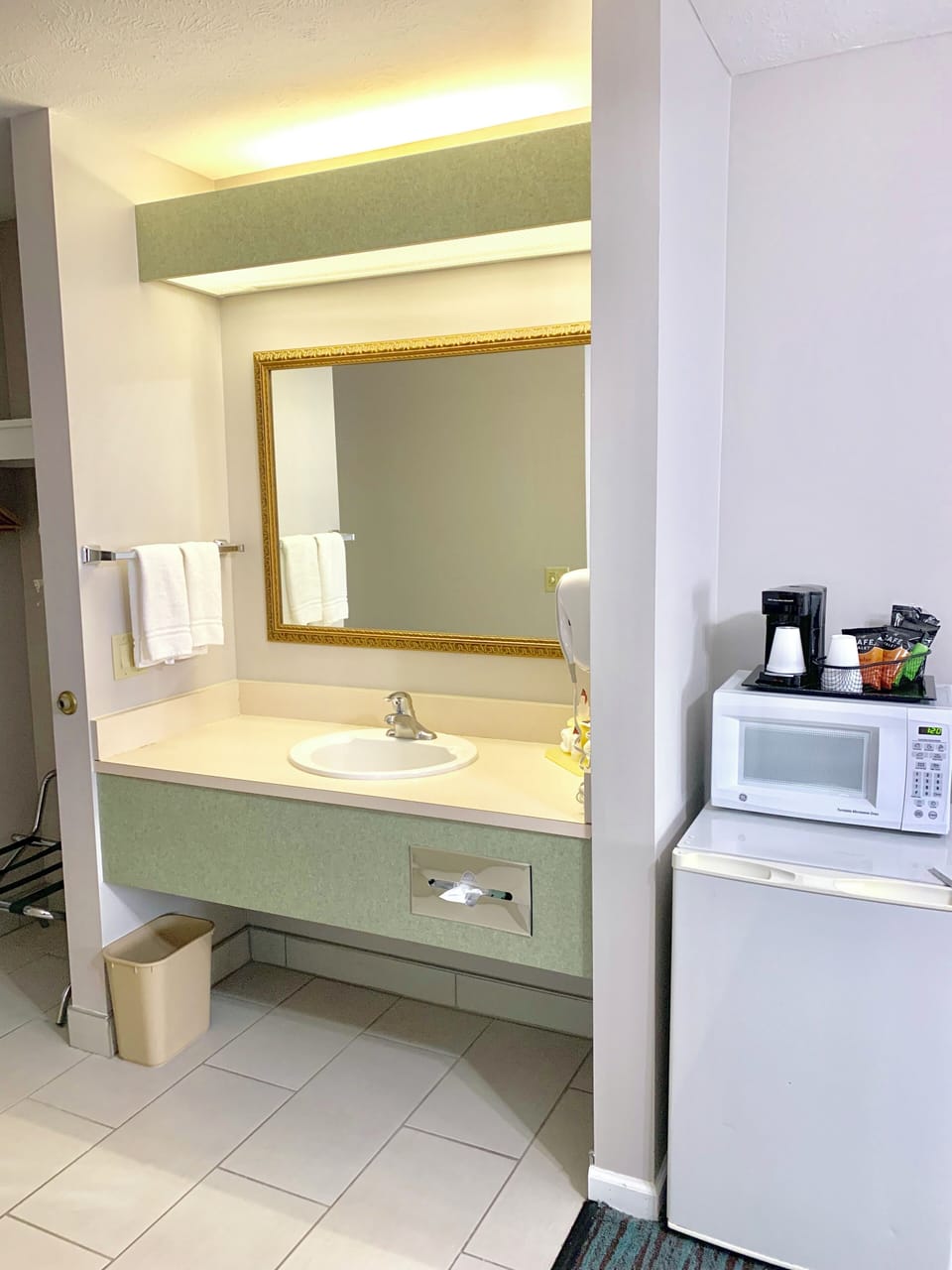 Premium bedding, desk, laptop workspace, blackout drapes