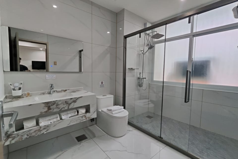 Standard Room | Bathroom | Shower, slippers, towels, soap