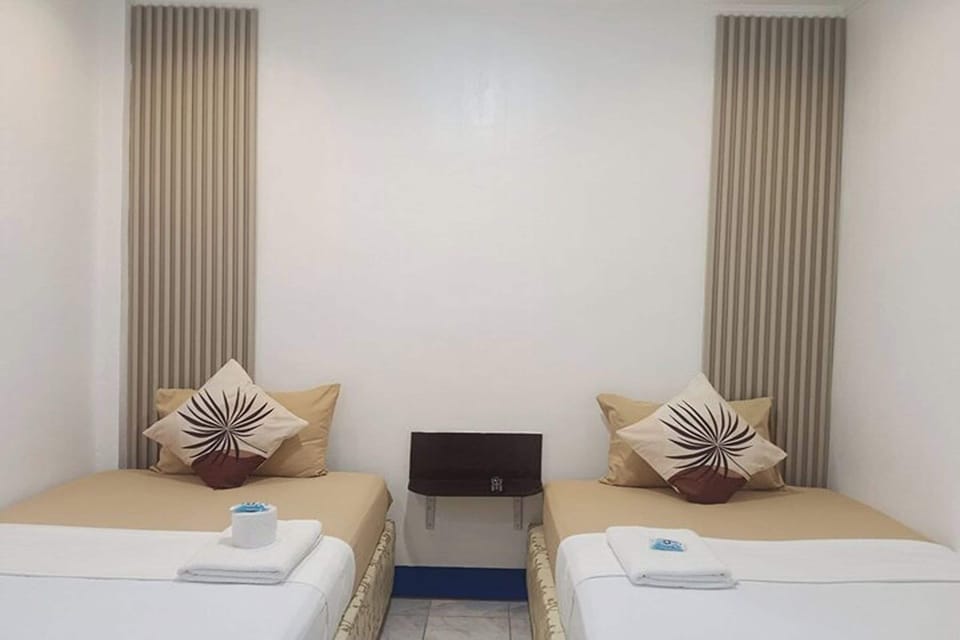 Twin Room | Desk, iron/ironing board, WiFi (free), bed sheets