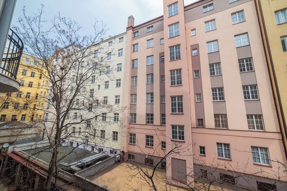 The apartment has windows into a quiet inner block