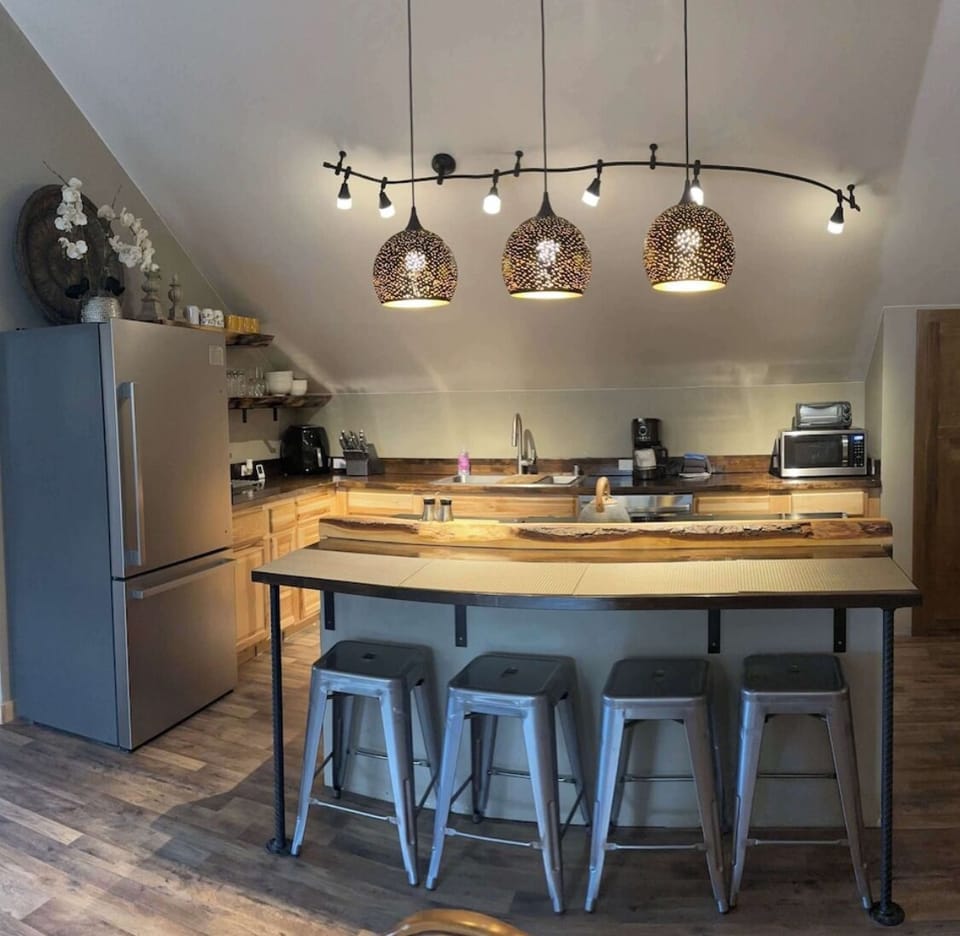 Full kitchen in open floor plan with living room and dining area