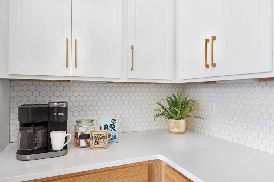 Fully Stocked Kitchen with Modern Appliances and Ample Storage
