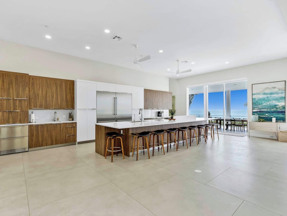 Kitchen with oversized island capable of seating 10 and Wolf/Sub Zero Appliances
