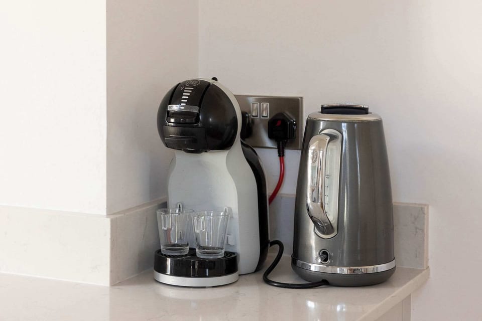 Tea or Coffee? This home offers a Nescafe Dolce Gusto coffee machine.