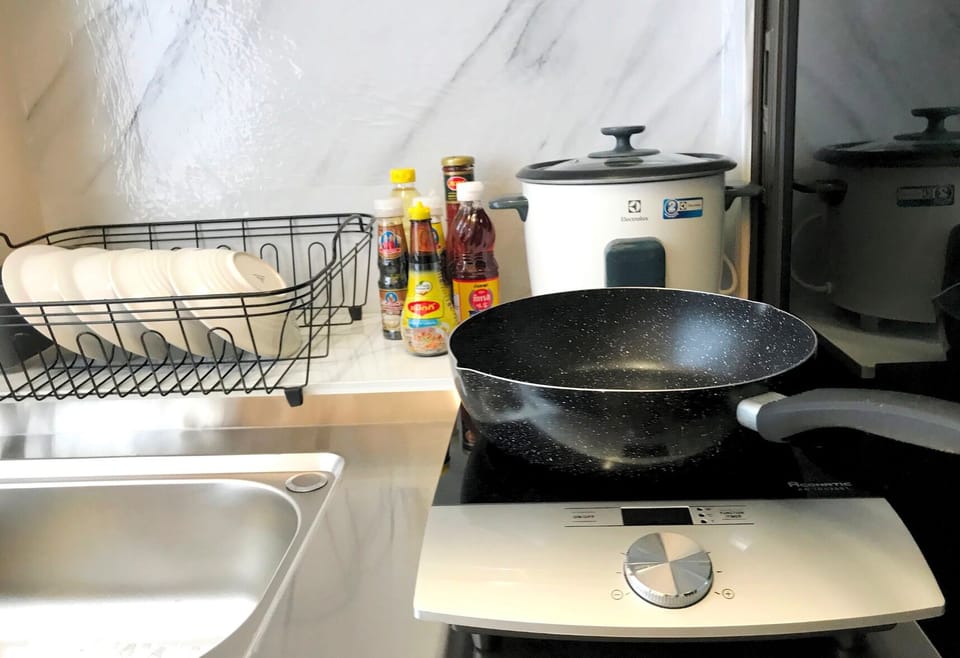 Cozy King Room with Kitchen | Private kitchen | Fridge, cleaning supplies