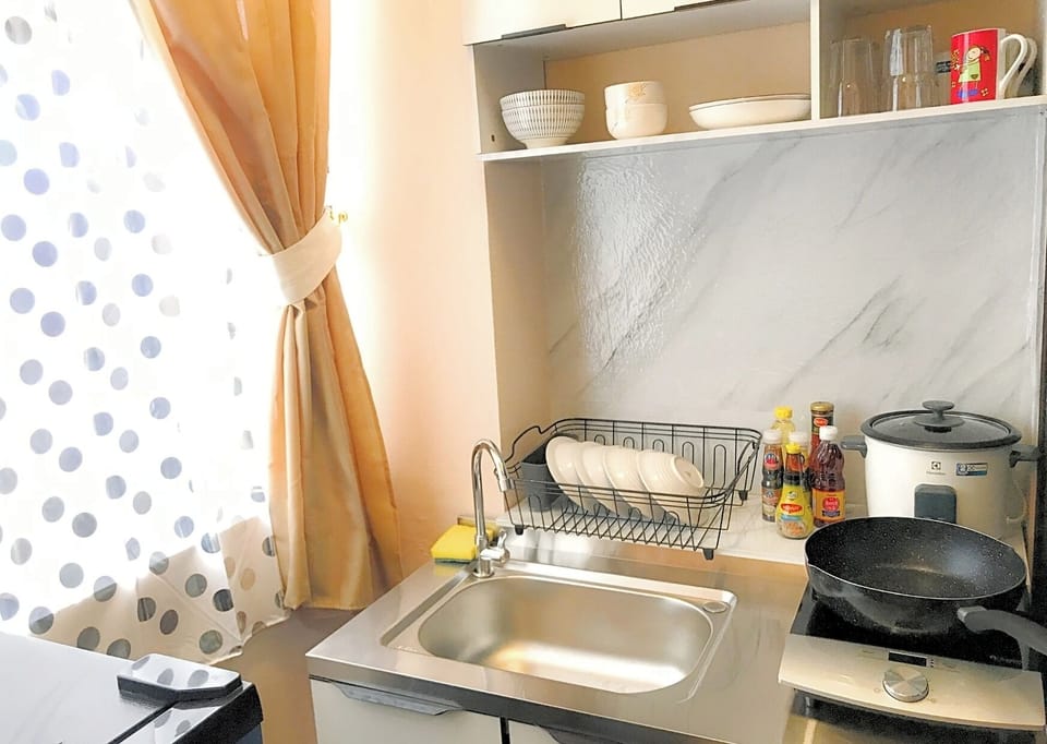 Cozy King Room with Kitchen | Private kitchen | Fridge, cleaning supplies