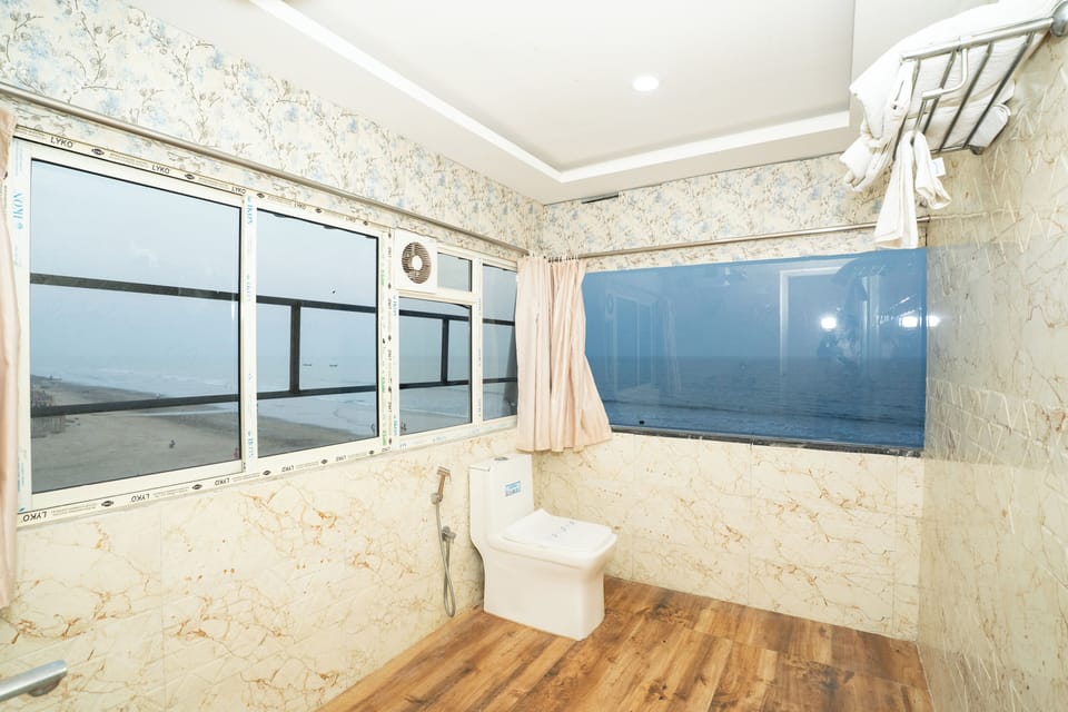 Deluxe Double Room, Balcony, Beach View | Bathroom | Shower, free toiletries, towels, soap