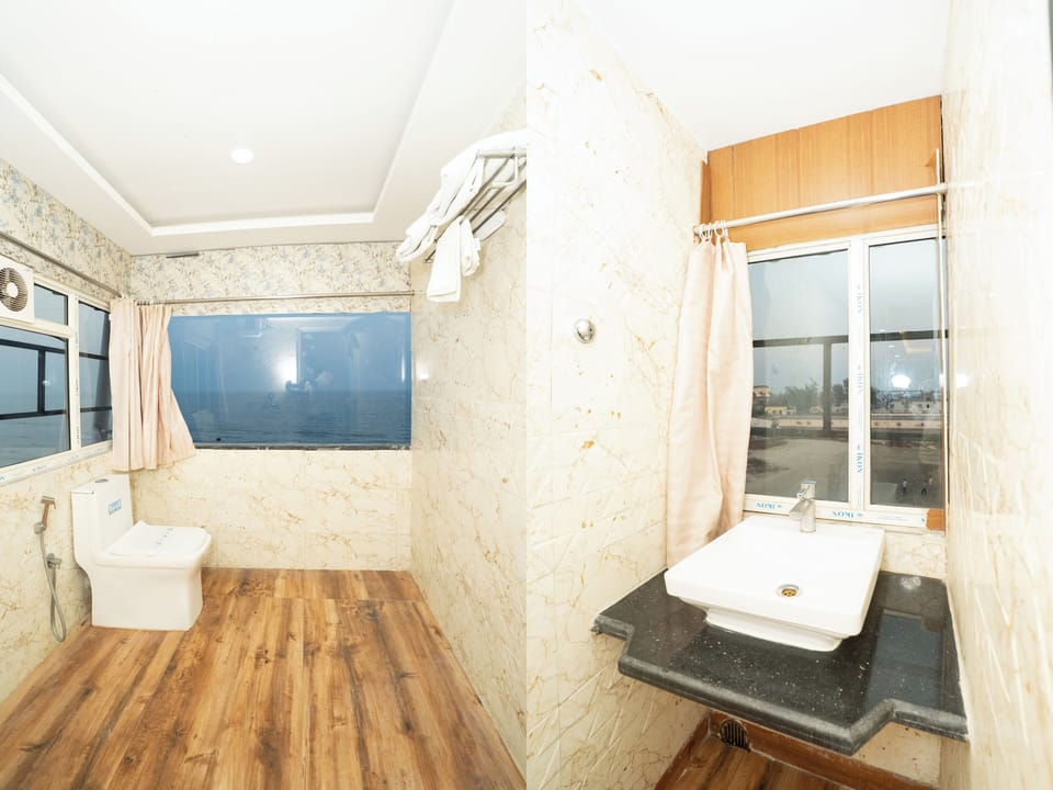 Deluxe Double Room, Balcony, Beach View | Bathroom | Shower, free toiletries, towels, soap
