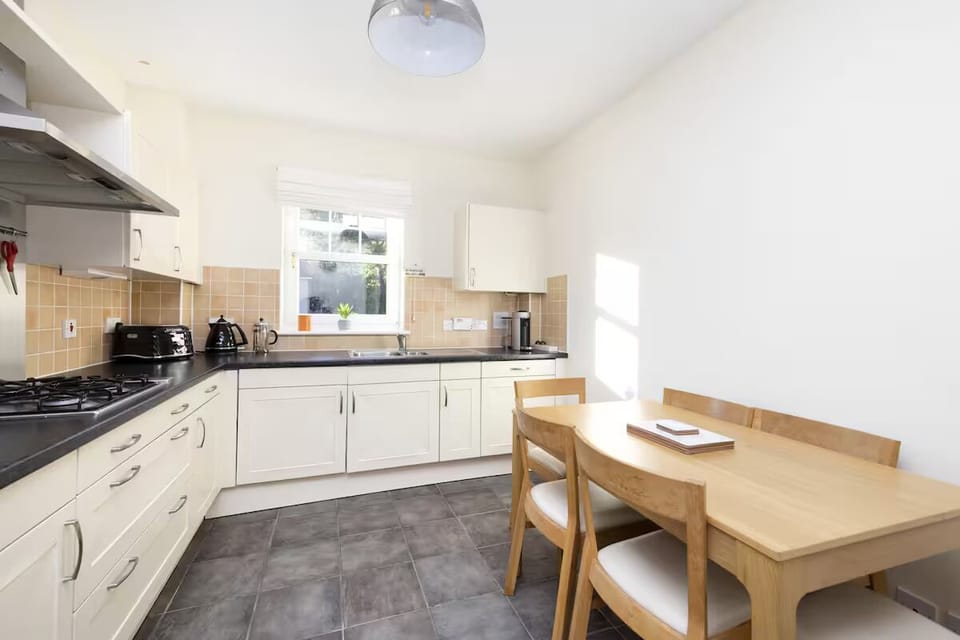 Comfort Apartment, City View | Private kitchen | Coffee/tea maker, electric kettle, dining tables