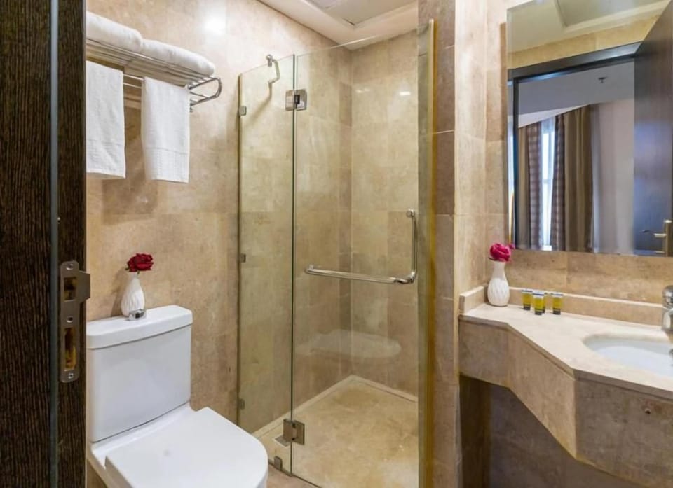 Separate tub and shower, towels, soap, shampoo