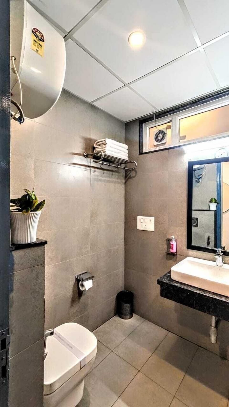 Shower, designer toiletries, hair dryer, slippers