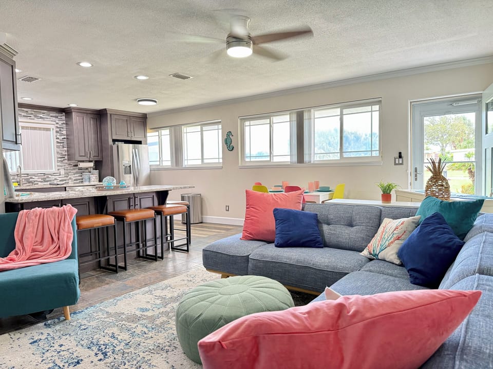 Living room: Natural tones and ocean-inspired decor create calm vibes. The perfect spot to recharge.