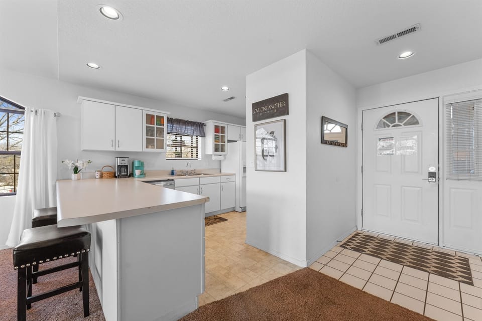 Bright, functional kitchen with generous counter space and an easy flow from the front door to the heart of the condo.
