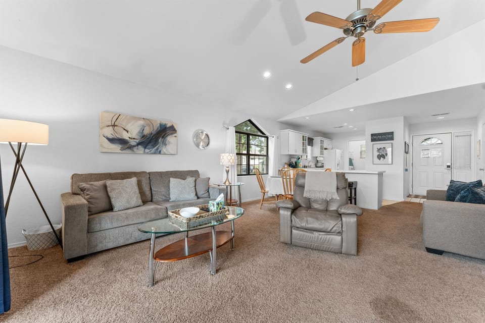 Another full-room angle that helps show the condo’s roomy layout and vaulted, airy feel.
