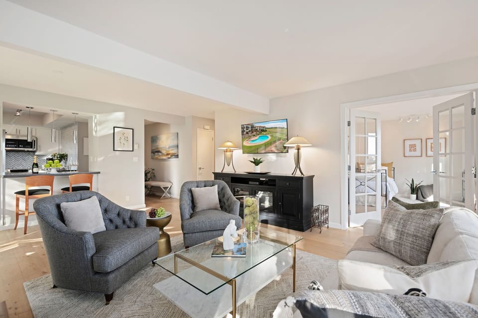 Living room with TV and fireplace
