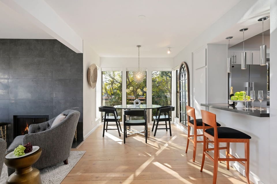 Charming dining area surrounded by treetop garden views