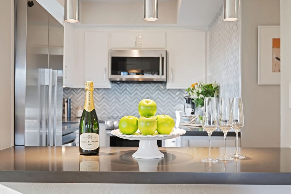 Quaint kitchen bar area with two bar stools