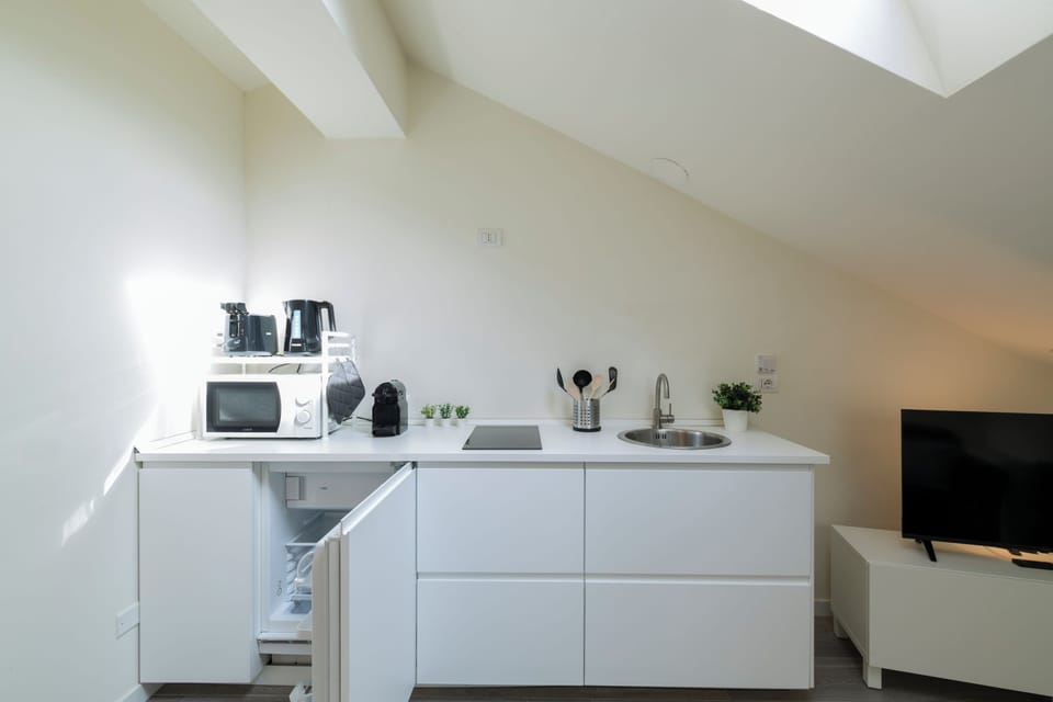 Deluxe Condo | Private kitchen | Mini-fridge, microwave, stovetop, espresso maker