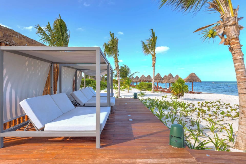 Relax in our private beach cabanas.