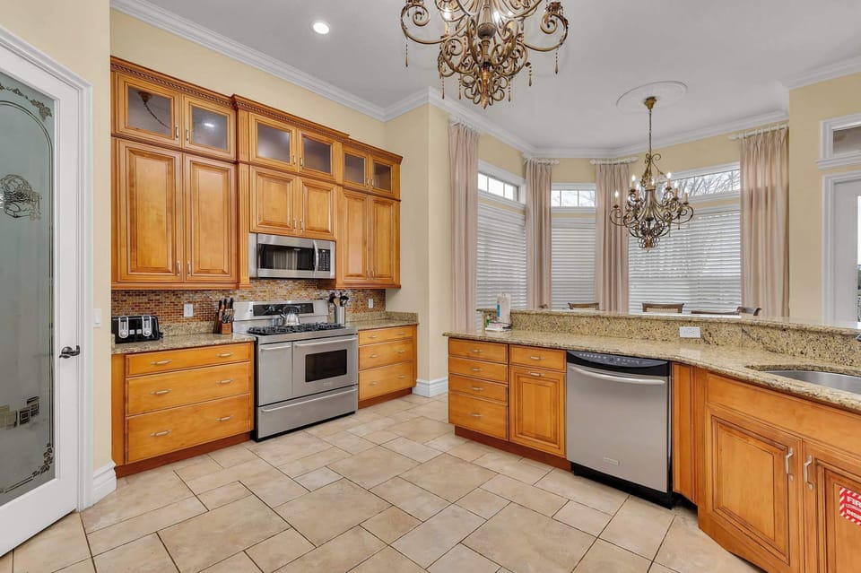 Whip up delicious meals in this spacious and fully equipped kitchen. Perfect for creating culinary masterpieces and family feasts