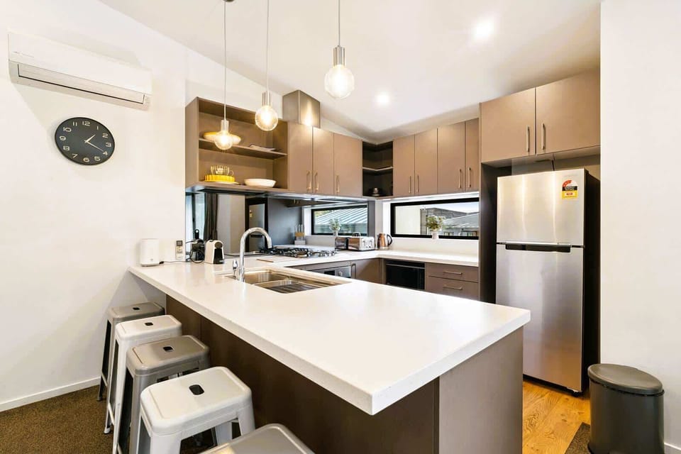 Stylish kitchen with island seating and modern appliances