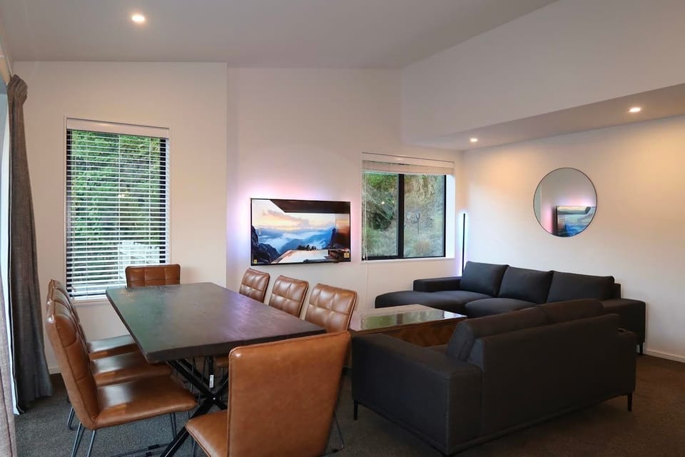 Cozy lounge with smart TV and modern seating