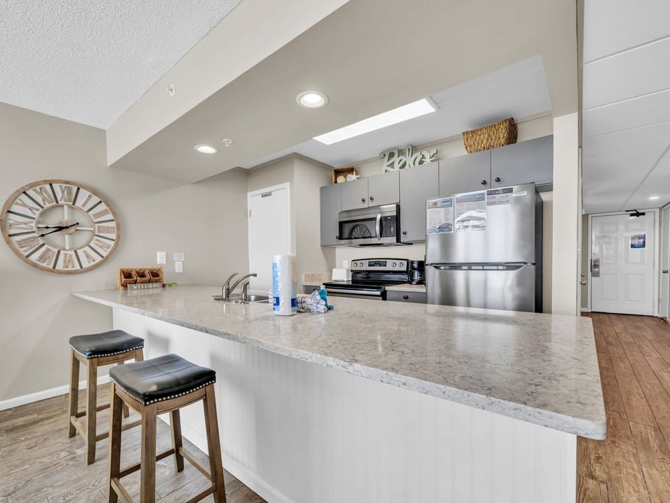 Convenient eat-in bar, offering additional seating right off the kitchen