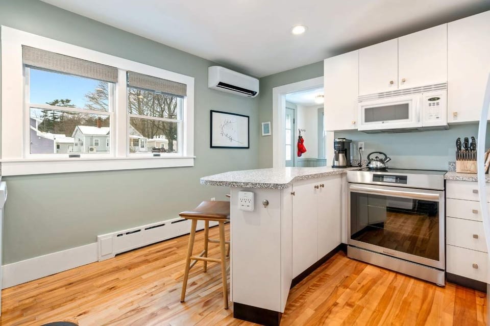 The main house’s kitchen offers ample space & every home comfort