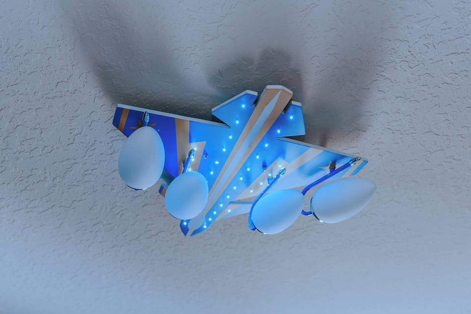 Brighten your stay with this unique ceiling fixture that combines playful design with functional lighting. The blue and white scheme adds a whimsical touch, ensuring the atmosphere feels both cheerful and well-appointed.