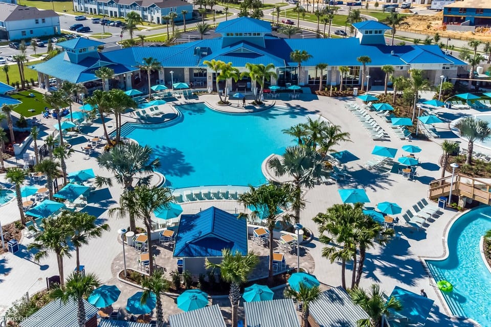 Immerse yourself in tropical vibes at this beautiful pool area, where turquoise waters sparkle in the sun and palm trees sway. Relax in cozy lounge chairs, making it the perfect place to unwind and enjoy the ambiance.