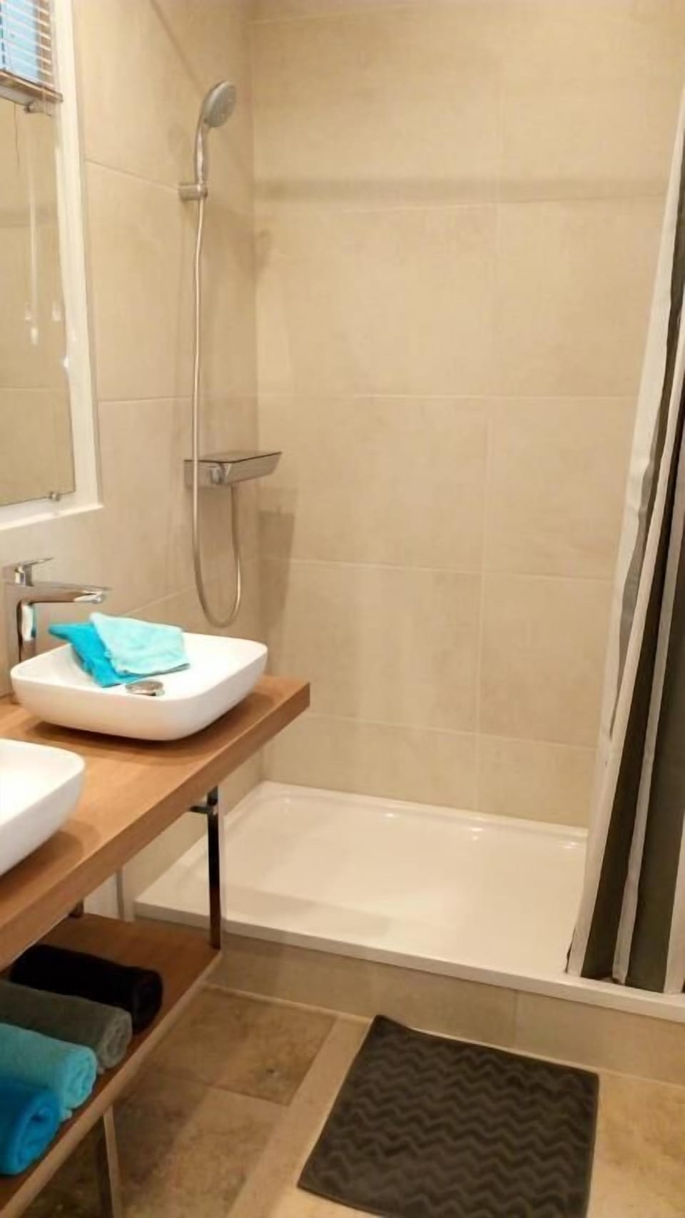 Shower, hair dryer, towels, toilet paper