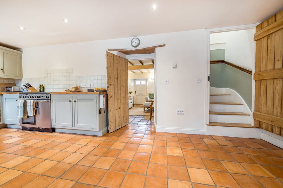 staircase off the kitchen/dining area