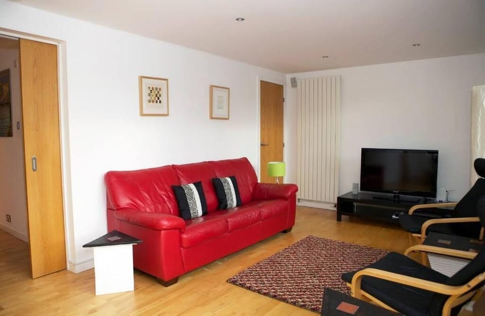Standard Apartment | Living area | 24-inch flat-screen TV with cable channels, TV