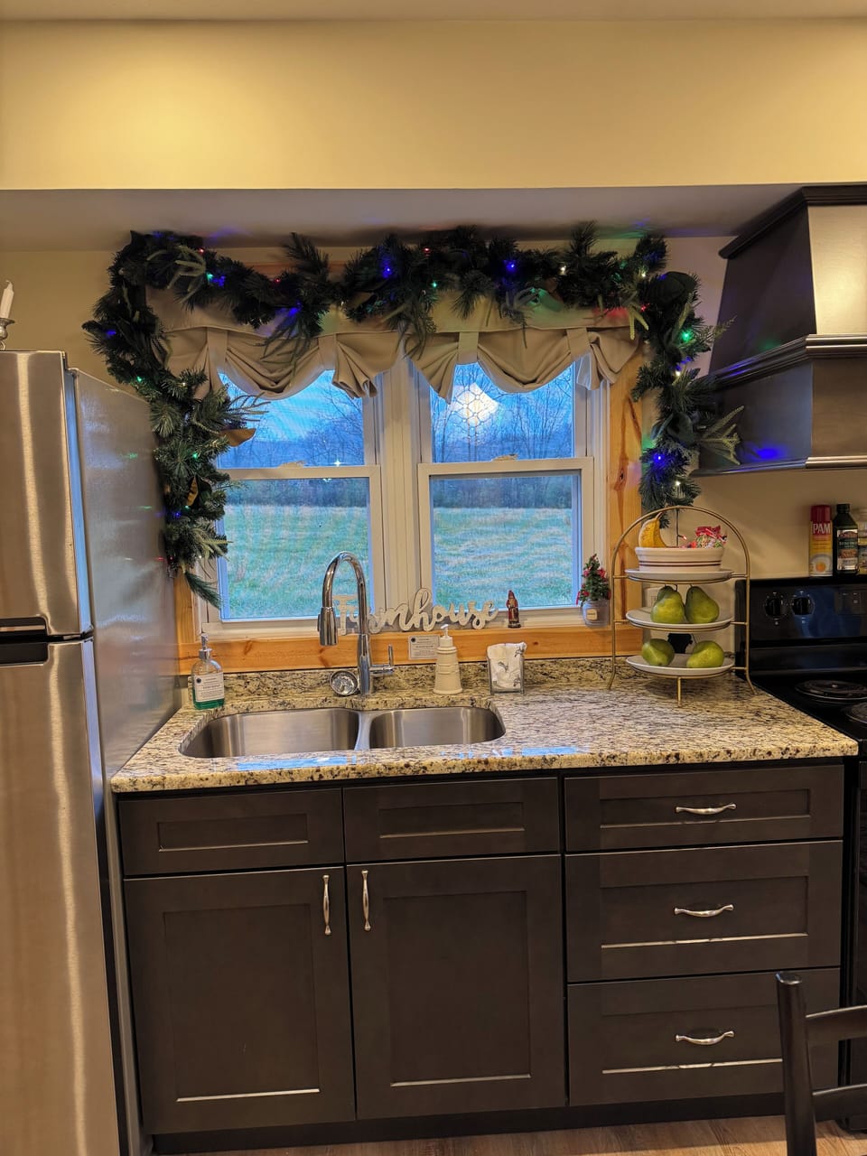 In the kitchen you find it fully stocked, and granite countertops.