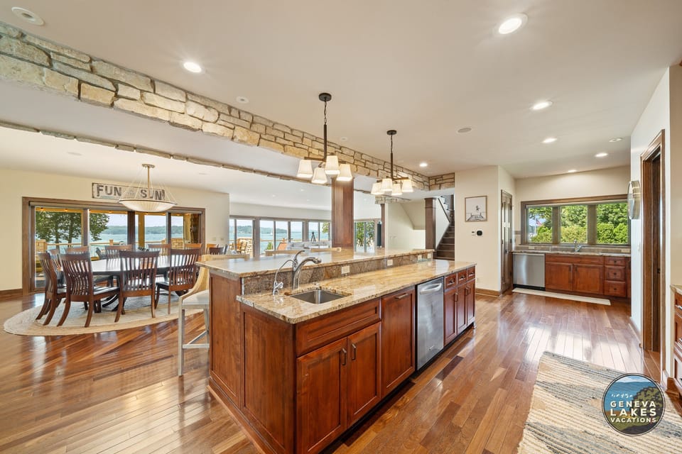 Open concept kitchen, dining to living room