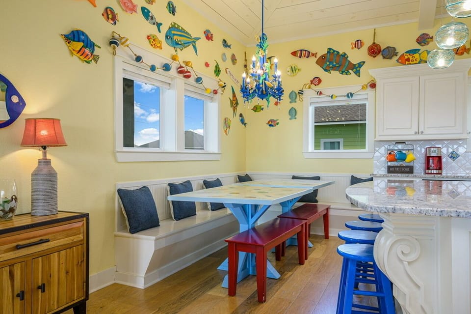 Dining room with seating at tables and island bar