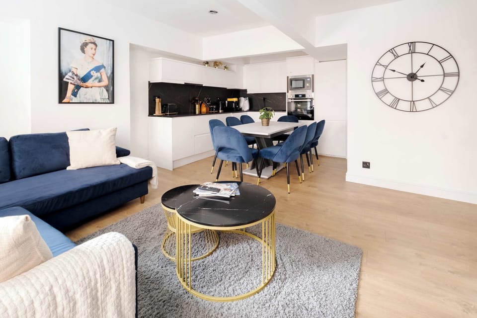 Living Room | Unwind in style in a beautifully designed, spacious living room featuring a 75-inch smart TV and air conditioning, thoughtfully curated for your ultimate comfort.
