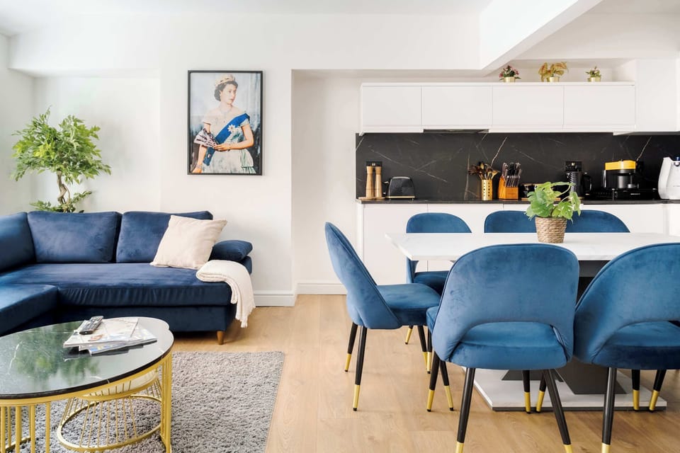Living Room | Unwind in style in a beautifully designed, spacious living room featuring a 75-inch smart TV and air conditioning, thoughtfully curated for your ultimate comfort.