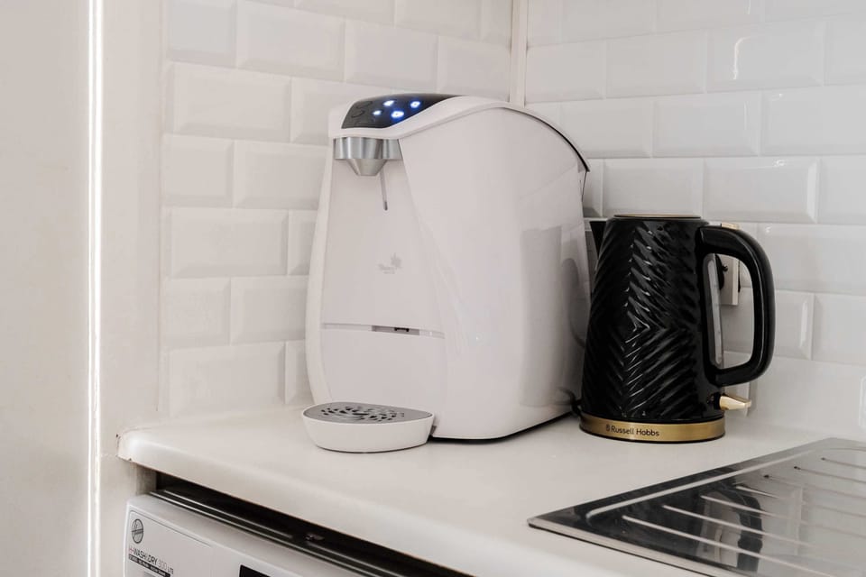Kitchen | No need to buy bottled water or drink from the tap, the kitchen is equipped with a Virgin Pure fresh filtered water dispenser offering both hot and cold water.